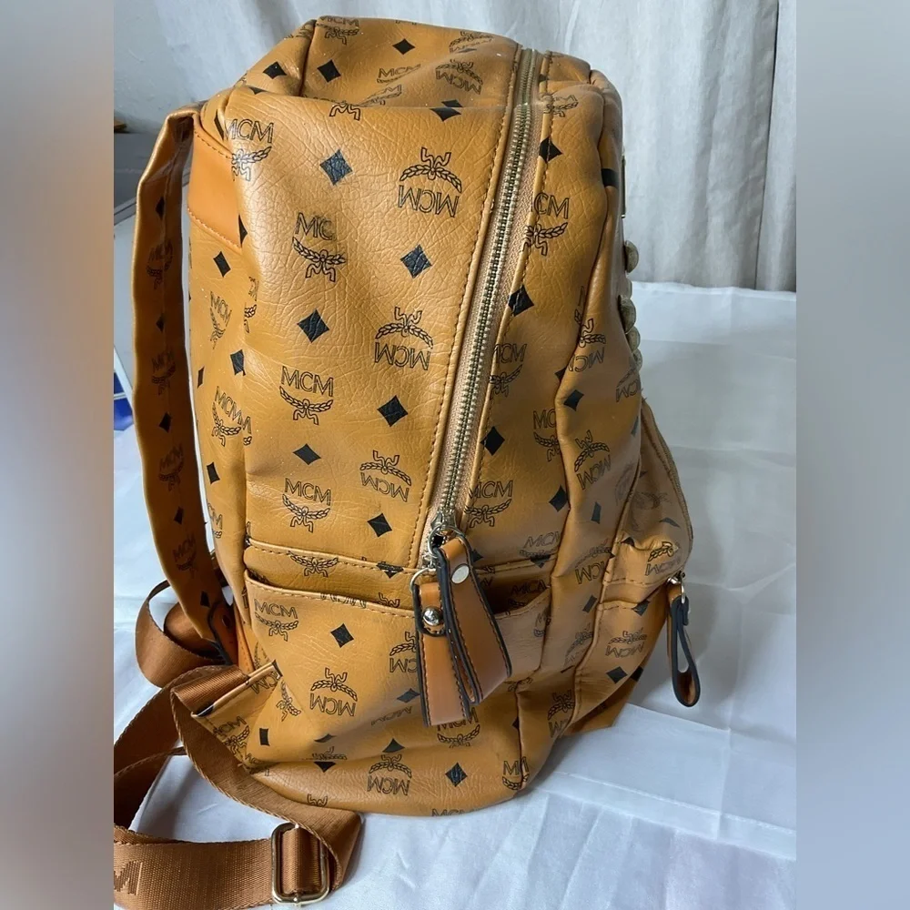 MCM Tan Backpack with Iconic Monogram Design